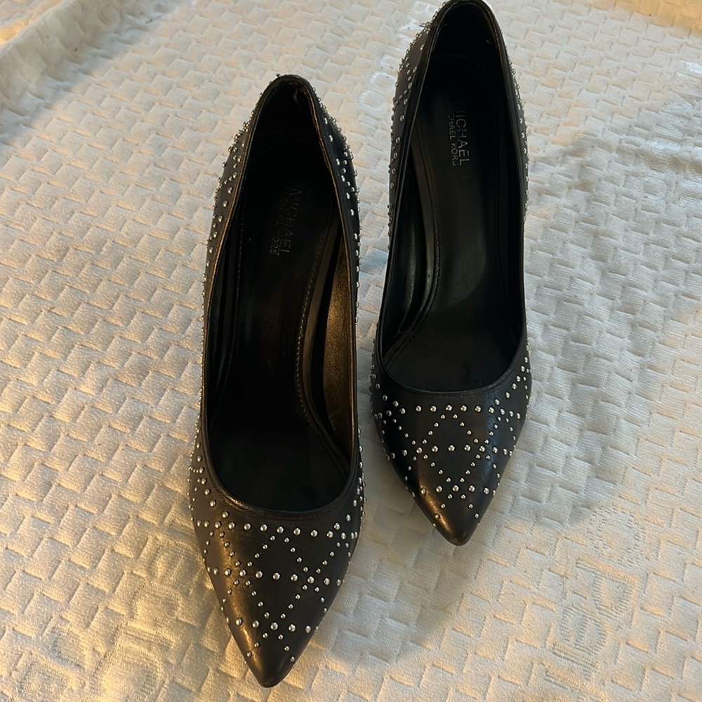 Michael Kors studded pumps.